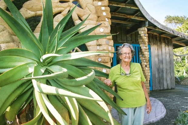 Dhaj and her organic mud-brick house.