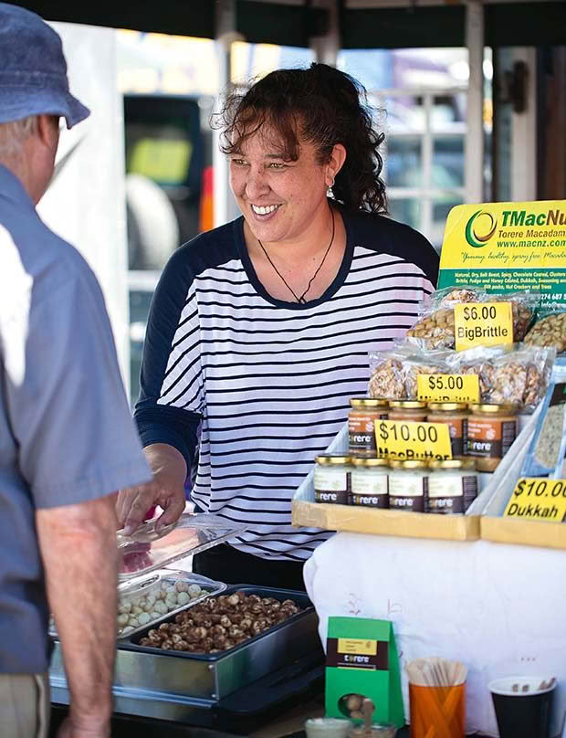  Vanessa’s daughter, Angelina, helps out at the market. 