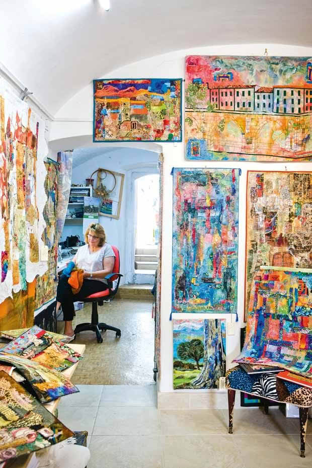 A converted wine cellar make s a perfect studio for Averil, who can spend up to 12 hours a day working on her art surrounded by trunks of fabric treasures unearthed from attics, street markets and second-hand shops in Italy and New Zealand.