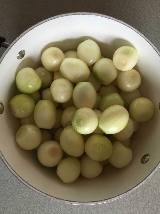 Peel the onions and then sprinkle with salt and leave overnight.