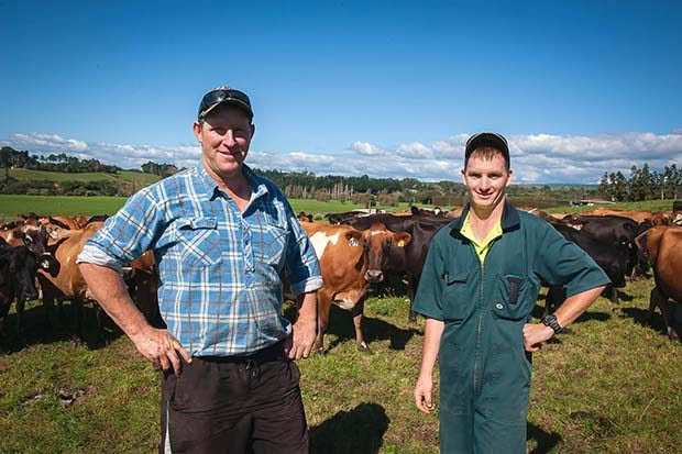 Dairy farmer Carl Williams with assistant Joshua Watson.