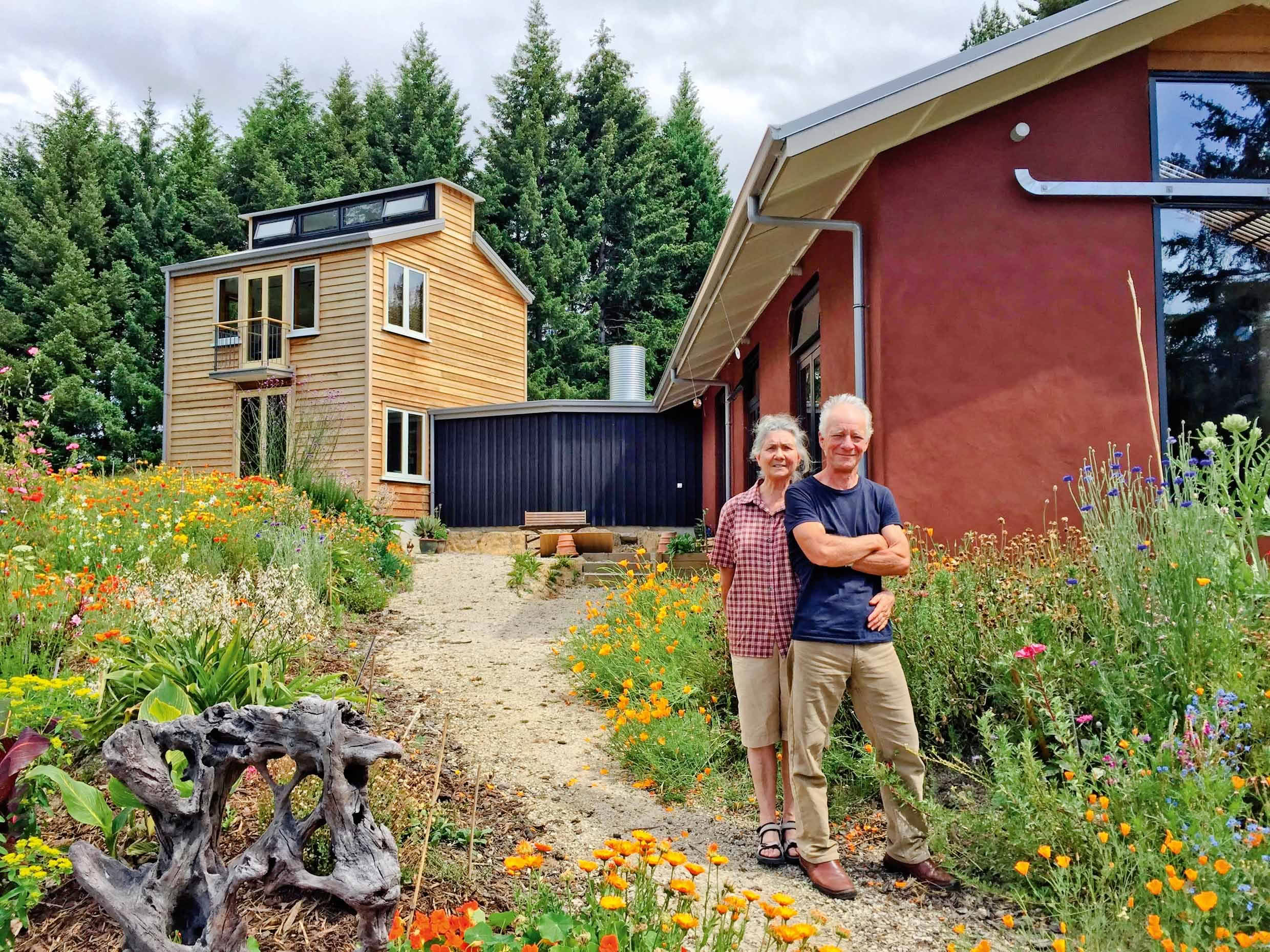 Anneka de Leur, left and Philip Kennedy outside their straw bale home in Riwaka.