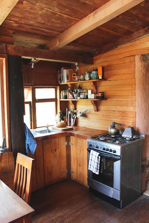 The macrocarpa kitchen has cupboards, shelves and hooks to avoid cluttering up the tiny benchtop. Even so, only one of us can work in the kitchen at a time, otherwise we end up quite literally stepping on each other.