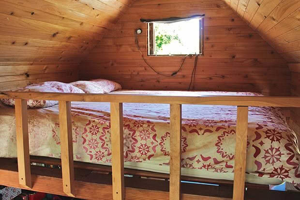 The 'master bedroom' is tucked up on a mezzanine in the main bedroom and accessed by a ladder, with just enough room for a queen bed. From the bed we can watch all three of our children sleeping which is lovely when they're asleep (not so lovely when they're not).