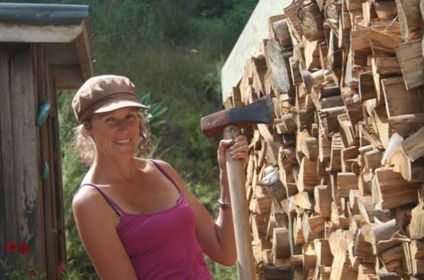 Blogger Polly Greeks chopping wood