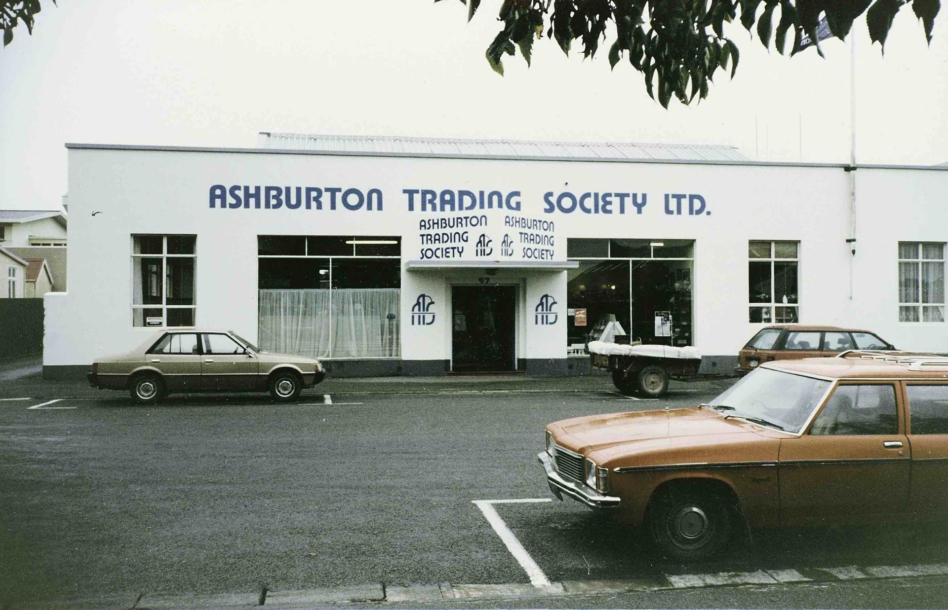 Ashburton trading society ltd building with cars parked in front of it