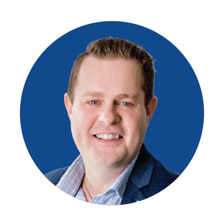 A man in a suit is smiling in a blue circle.
